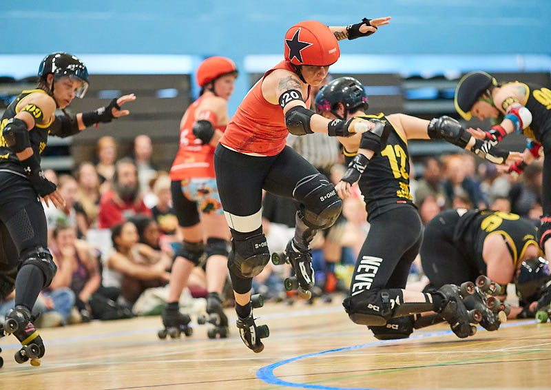 A skater for the London Rockin' Rollers takes a leap