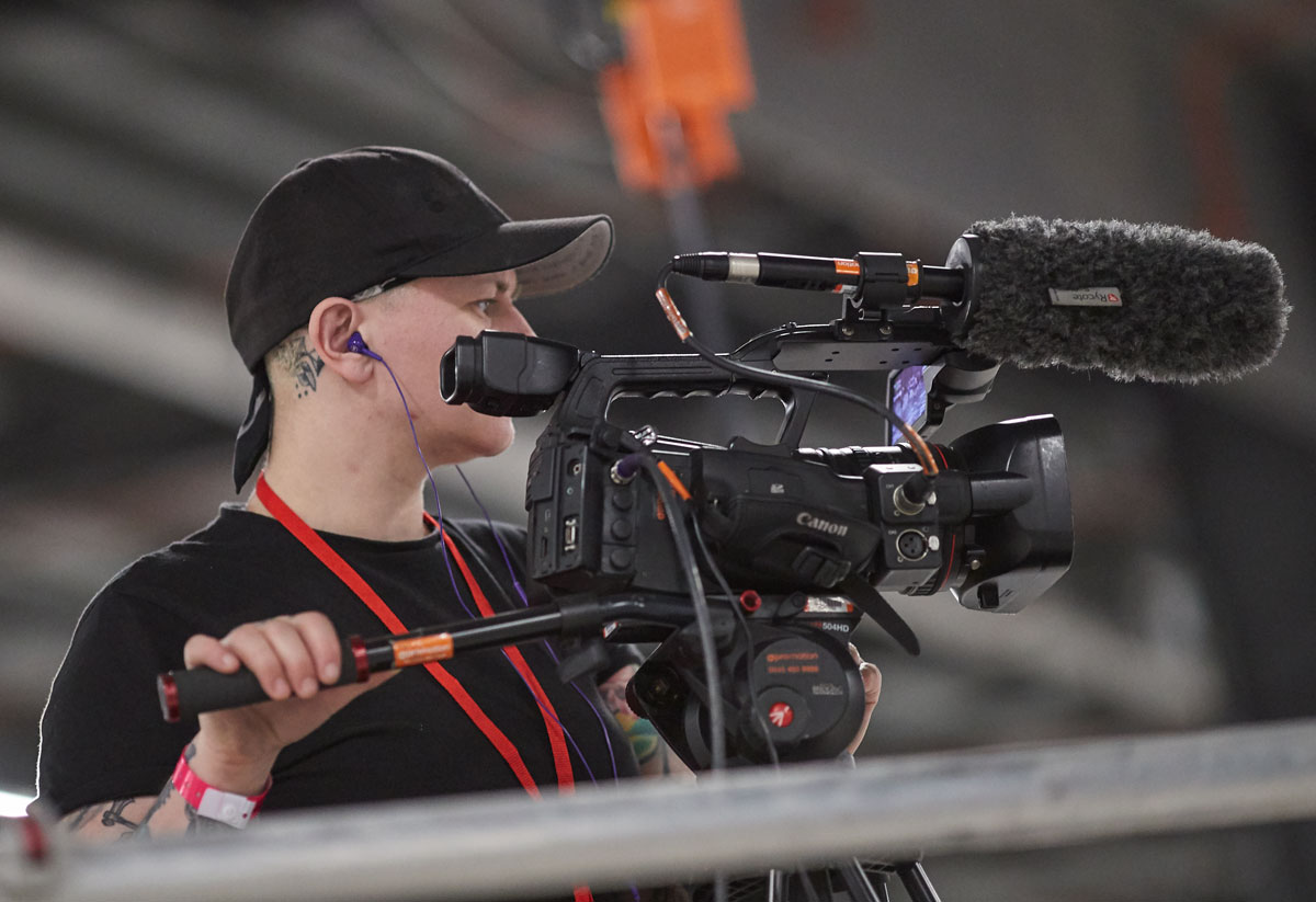 Michelle Deakin filming one of the group bouts for the live feed at the Roller Derby World Cu